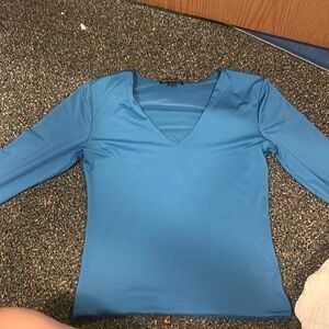 Tight blue mid length shirt